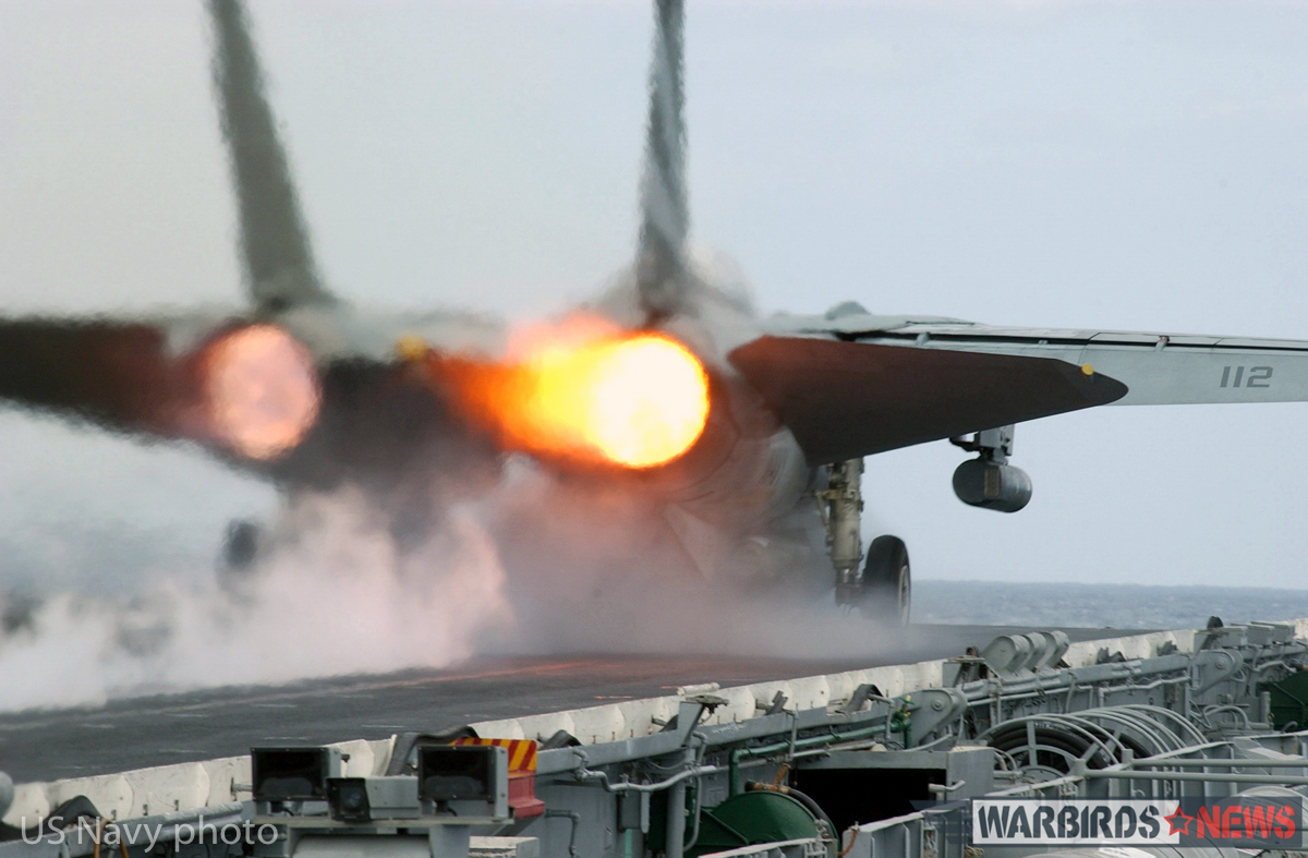 At sea aboard USS Kitty Hawk (CV 63) Nov. 9, 2002 -- An F-14 “Tomcat” assigned to the “Black Knights” of Fighter Squadron One Five Four (VF-154) ignites its afterburners during a launch from one of four steam driven catapults on the ship’s flight deck. Kitty Hawk is the Navy’s only permanently forward-deployed aircraft carrier and operates out of Yokosuka, Japan. U.S. Navy photo by Photographer’s Mate 3rd Class Todd Frantom. (RELEASED)