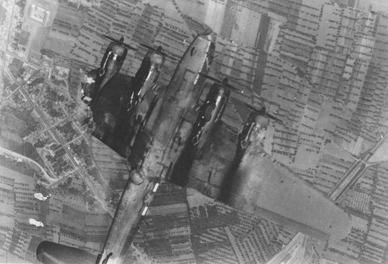 A B-17 Flying Fortress goes down with its ten man crew over occupied Europe following a direct hit from a German flak battery. (photo US Army Air Force)
