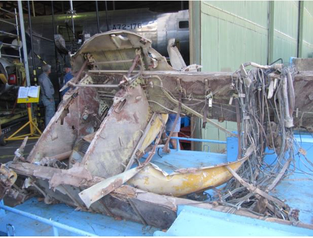 The wing center section from a wrecked Oxford seen soon after it had arrived via donation from South Australia. This item provided many useful original (small) parts, templates and details for the project. (photo via B-24 Liberator Memorial Fund)