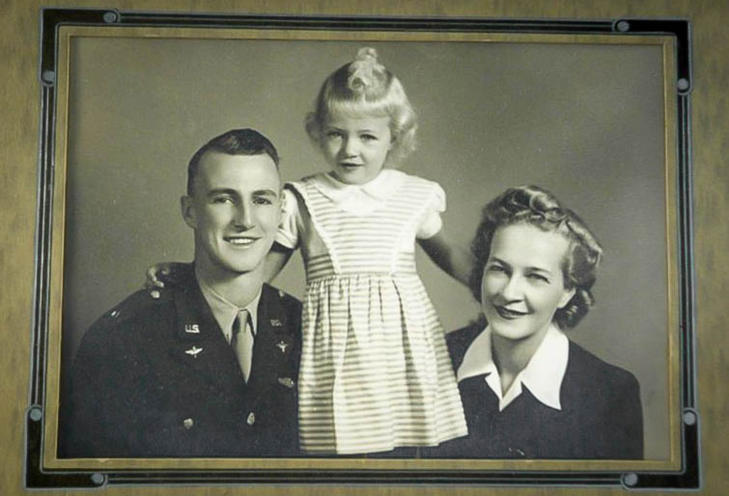 Captain Carl Ekstrom, his daughter Victoria, and wife Myrtle are shown in a family photo prior to his overseas involvement in World War II. Ekstrom was shot down over France while piloting a P-47 Thunderbolt following a bomber escort mission. (Courtesy photo)