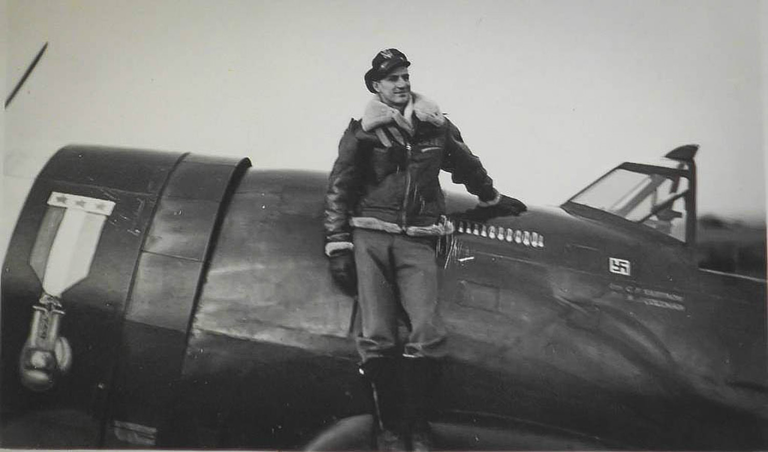 Capt. Carl Ekstrom poses with his battle tested P-47 Thunderbolt. Ekstrom was a two-time Golden Glove boxer which was signified by the distinct mural on his aircraft. Ekstrom was shot down over France while piloting a P-47 Thunderbolt following a bomber escort mission. (Courtesy Photo)