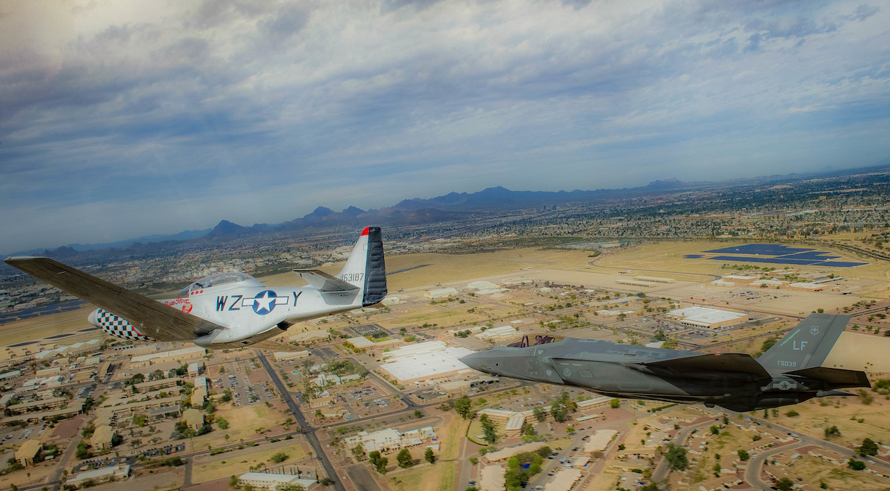 A P-51 Mustang and an F-35 Lightening II fly around the airspace of Davis-Monthan Air Force Base on March 4, 2016. The F-38 and the F-35 participated in Air Combat Command’s Heritage Flight Training Course, a program that features modern fighter/attack aircraft flying alongside Word War II, Korean War, and Vietnam War-era aircraft. (U.S. Air Force photo by Tech. Sgt. Brandon Shapiro)