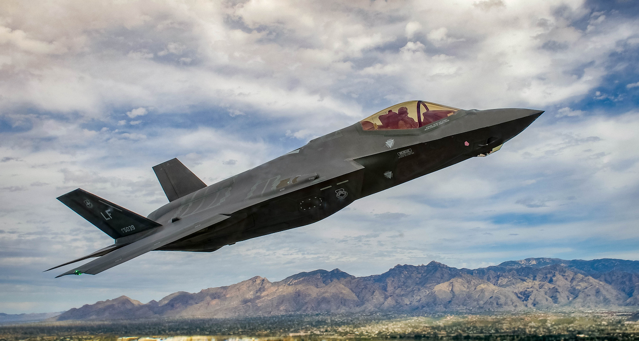 An F-35 Lightening II flies around the airspace of Davis-Monthan Air Force Base on March 5, 2016. The F-35 was participating in Air Combat Command’s Heritage Flight Training Course, a program that features modern fighter/attack aircraft flying alongside Word War II, Korean War, and Vietnam War-era aircraft. (U.S. Air Force photo by Tech. Sgt. Brandon Shapiro)