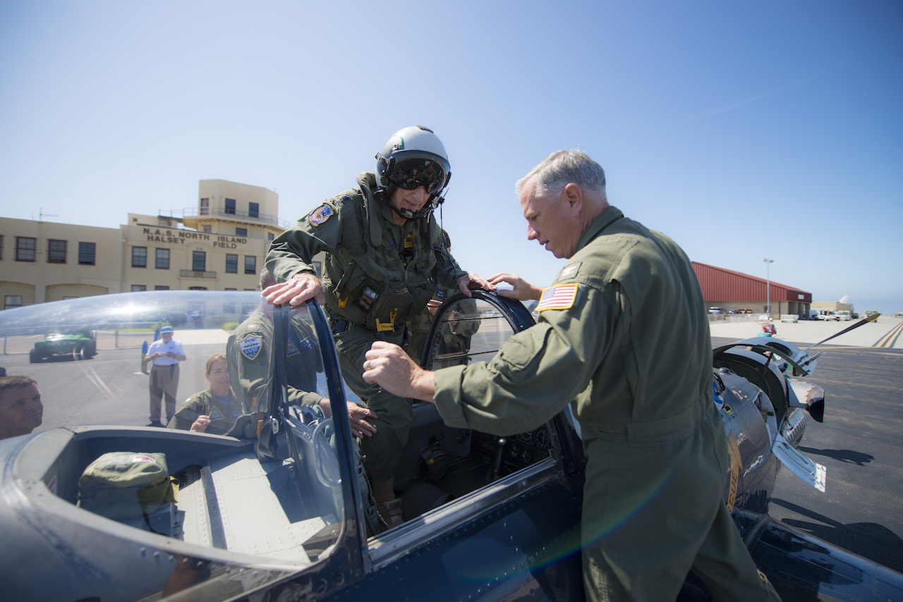 Retired Cmdr. Dean "Diz" Laird walks into the rear seat of a T-34C Turbomentor with the "Flying Eagles" of Strike Fighter Squadron (VFA) 122. The T-34C marks the 100th aircraft Laird has flown in his 95-year lifetime. (U.S. Navy photo by Mass Communication Specialist 2nd Class Paolo Bayas/Released)