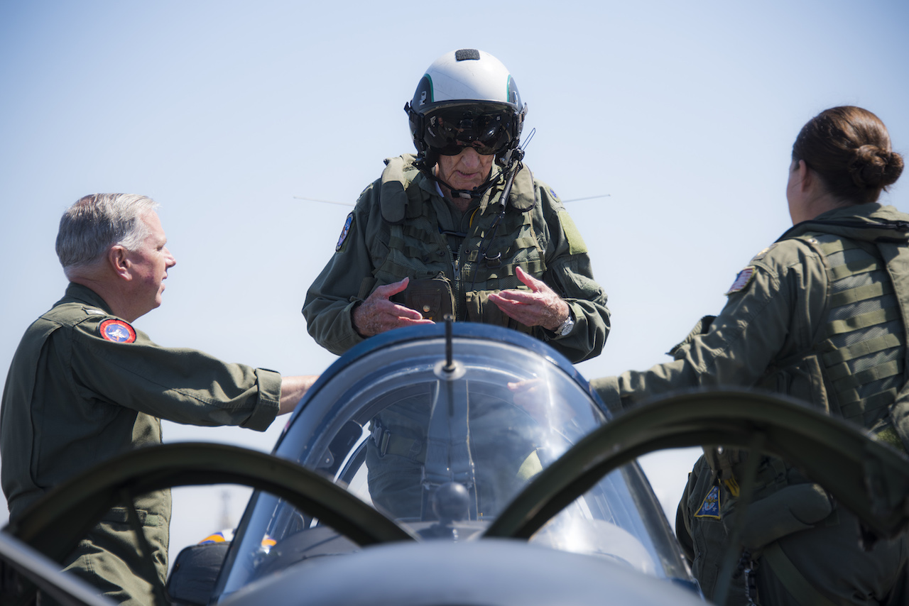 160709-N-TE278-116 CORONADO, California (July 9, 2016) Retired Cmdr. Dean "Diz" Laird, center, stands in the rear seat of a T-34C Turbomentor with the "Flying Eagles" of Strike Fighter Squadron (VFA) 122. The T-34C marks the 100th aircraft Laird has flown in his 95-year lifetime. (U.S. Navy photo by Mass Communication Specialist 2nd Class Paolo Bayas/Released)