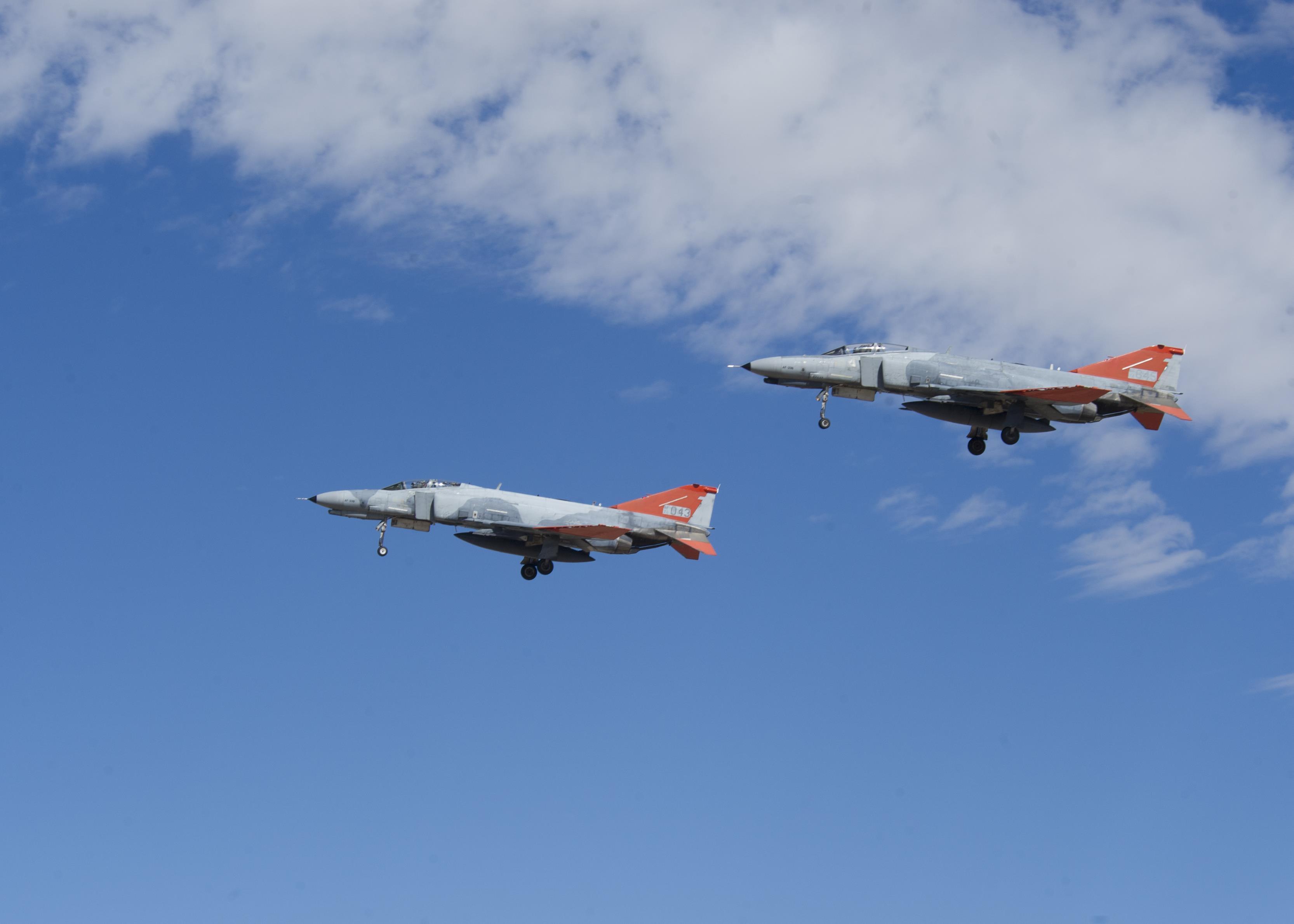 Two QF-4 Phantom IIs fly in formation over Holloman Air Force Base, N.M. on Sept. 13, 2016, in front of 160 spectators participating in Holloman’s annual Phantom Society Tour. The tour enabled aircraft enthusiasts, including veterans and non-veterans with aviation backgrounds, to learn more about Holloman AFB’s aircraft and mission. The tour included an F-16 Fighting Falcon static display and briefing, travel to Holloman’s High Speed Test Track, the opportunity to view QF-4 Phantom IIs and F-16s in flight, and a visit to the base’s heritage park to view static displays of various aircraft historically stationed at Holloman AFB. (U.S. Air Force photo by Master Sgt. Matthew McGovern)