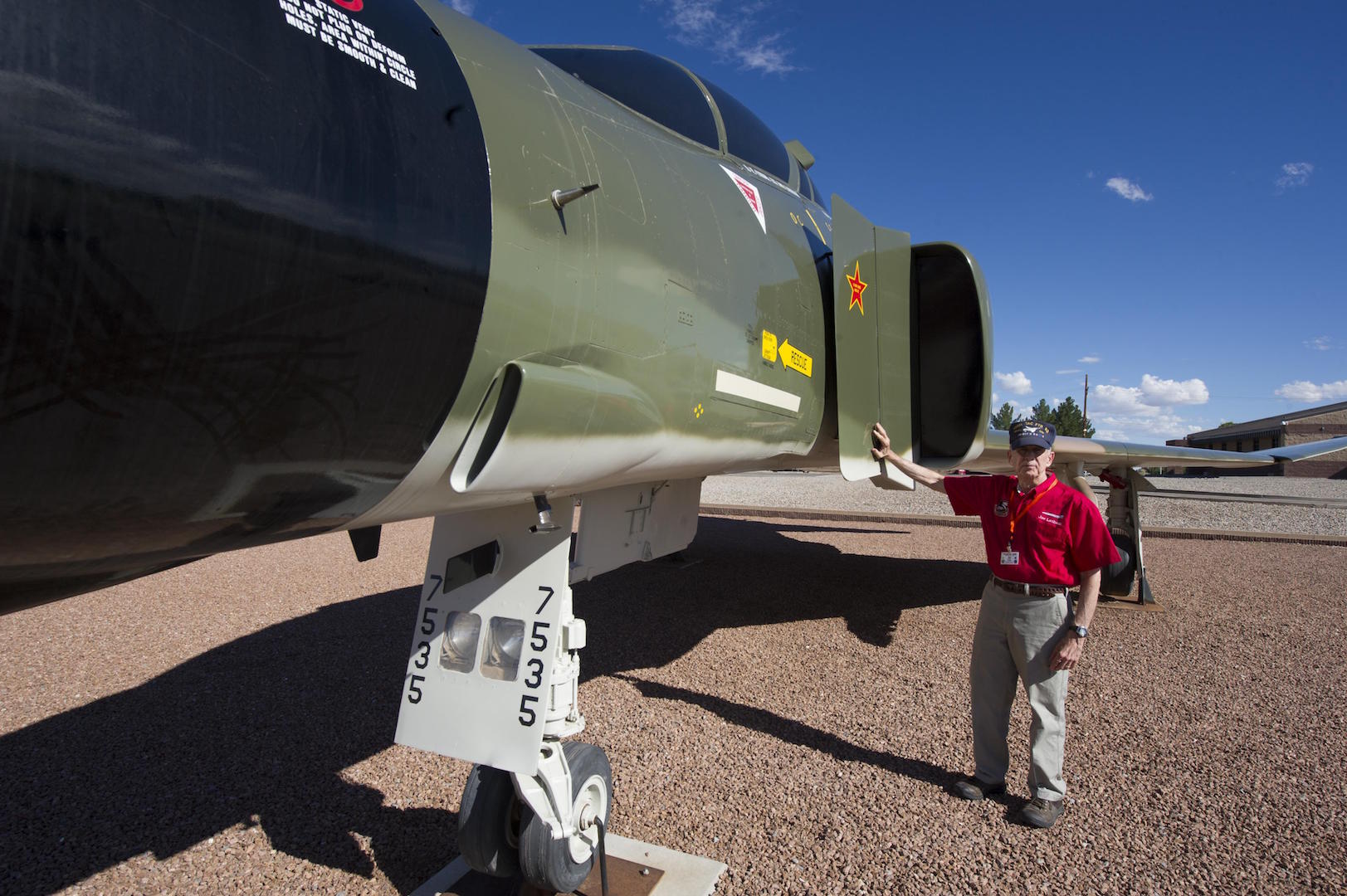 Col. (Ret.) Joe Latham, previously an F-4 Phantom pilot from Holloman Air Force Base, N.M., stops Sept. 13, 2016, to reminisce next to the F-4 adorned with his name Sept. 13, 2016, at Holloman AFB’s Heritage Park. Latham’s visit was part of Holloman’s annual Phantom Society Tour where 160 aircraft enthusiasts, including veterans and non-veterans with aviation backgrounds, visit various base locations. The tour included an F-16 Fighting Falcon briefing and static display, travel to Holloman’s High Speed Test Track, the opportunity to view QF-4s and F-16s in flight, and a visit to Heritage Park to view displays of various aircraft historically stationed at Holloman AFB. (U.S. Air Force photo by Master Sgt. Matthew McGovern)