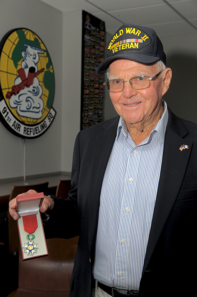Keith Cole, displays his French Legion of Honor after his tour of the flightline at MacDill Air Force Base, Fla., Jan. 18, 2017. In France, the Legion of Honor is the highest decoration that can be obtained, and Cole earned it by assisting in Operation Carpetbagger where he helped drop supplies to French resistance fighters. (U.S. Air Force photo by Airman 1st Class Adam R. Shanks)