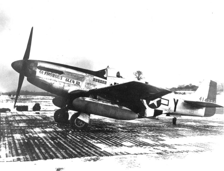 Chuck Yeager's P-51, "Glamorous Glen III" with external fuel tanks mounted and sporting 12 kill flags.