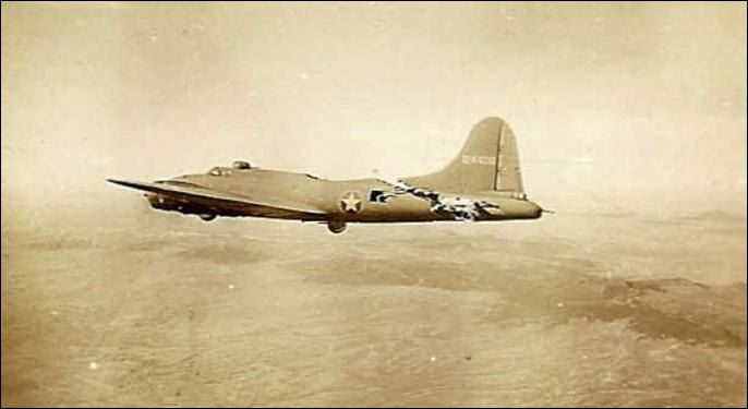 Stricken B-17 "All American" miraculously flying after collision with a German fighter, photographed by the crew of another bomber in her formation.
