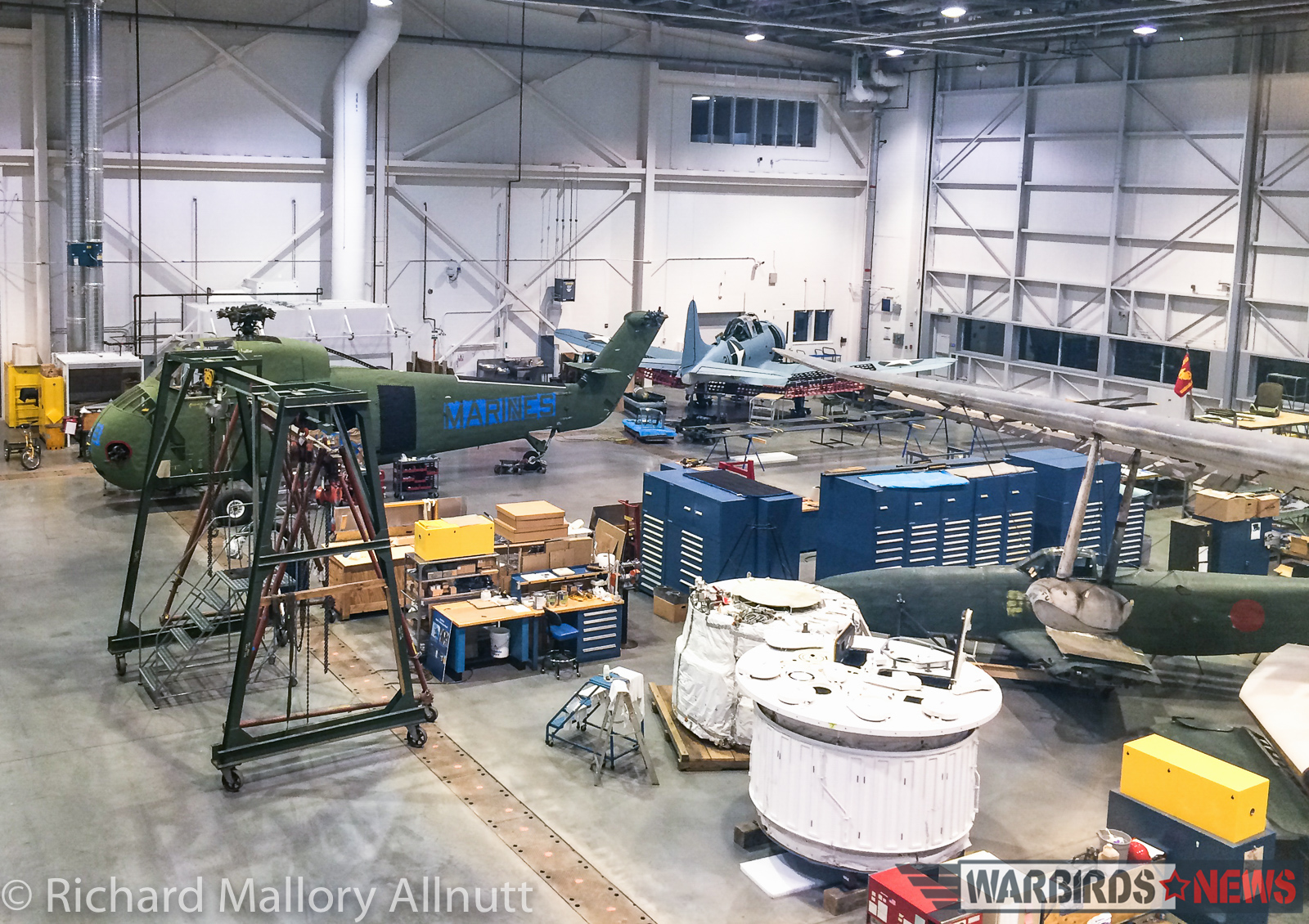 The National Museum of the United States Marine Corps' SBD Dauntless and H-34 can be seen in the distance. The H-34 was airworthy, until fairly recently, but couldn't find a buyer so the owners donated her to the Corps. She, along with the Dauntless, will soon be going on display in the main atrium of their new home. (photo by Richard Mallory Allnutt)