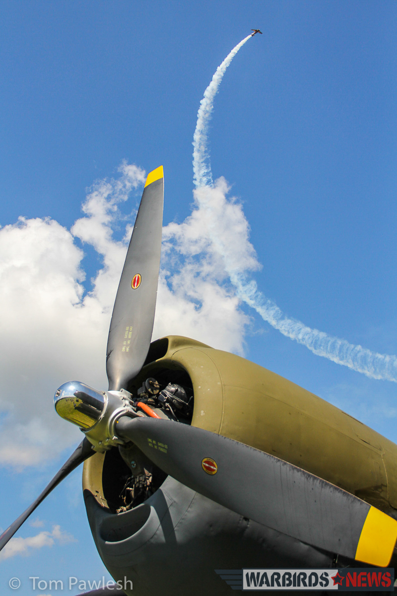 A glorious composition of an aerobatics display above the C-46's engine. (Photo by Tom Pawlesh)