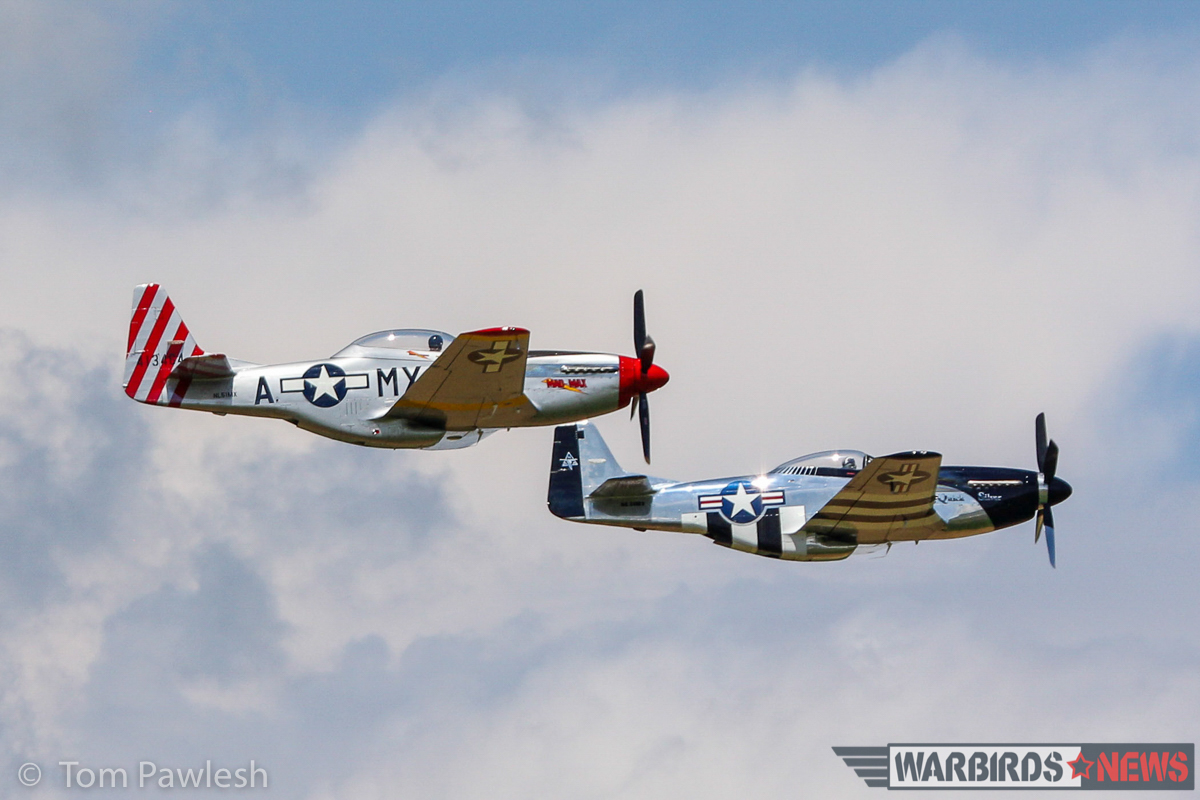A pair of P-51s making a low, formation pass. (Photo by Tom Pawlesh)