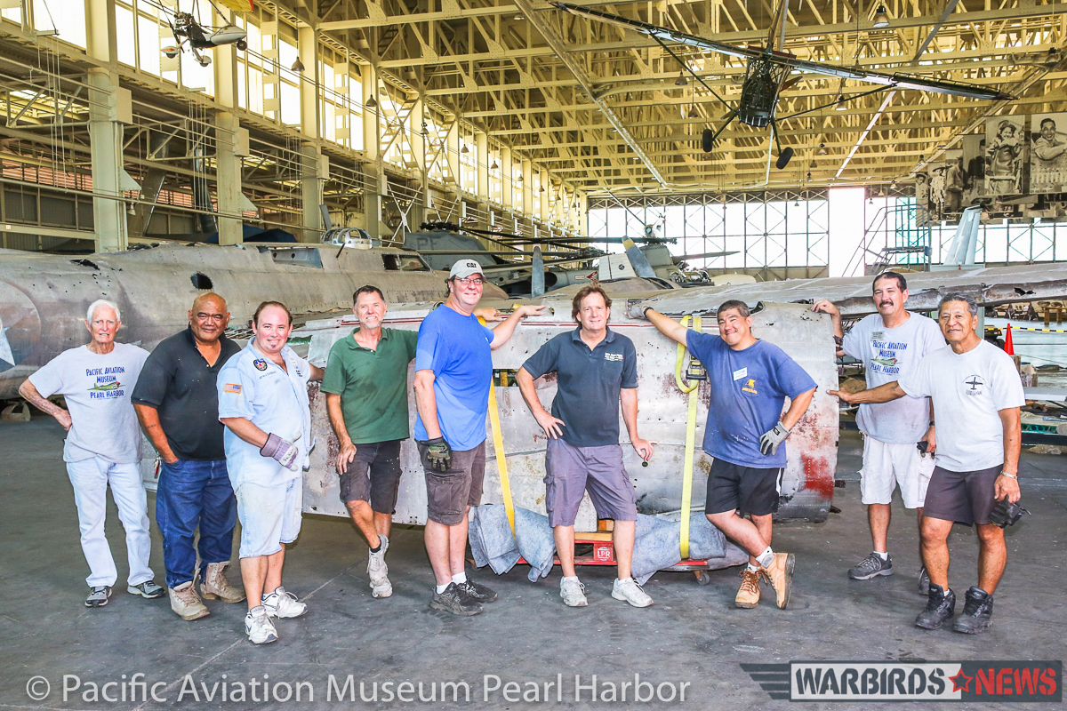 Museum staff standing in front of the freshly-unloaded Kate after a lot of sweaty work getting the job done! (photo via Pacific Aviation Museum Pearl Harbor) 
