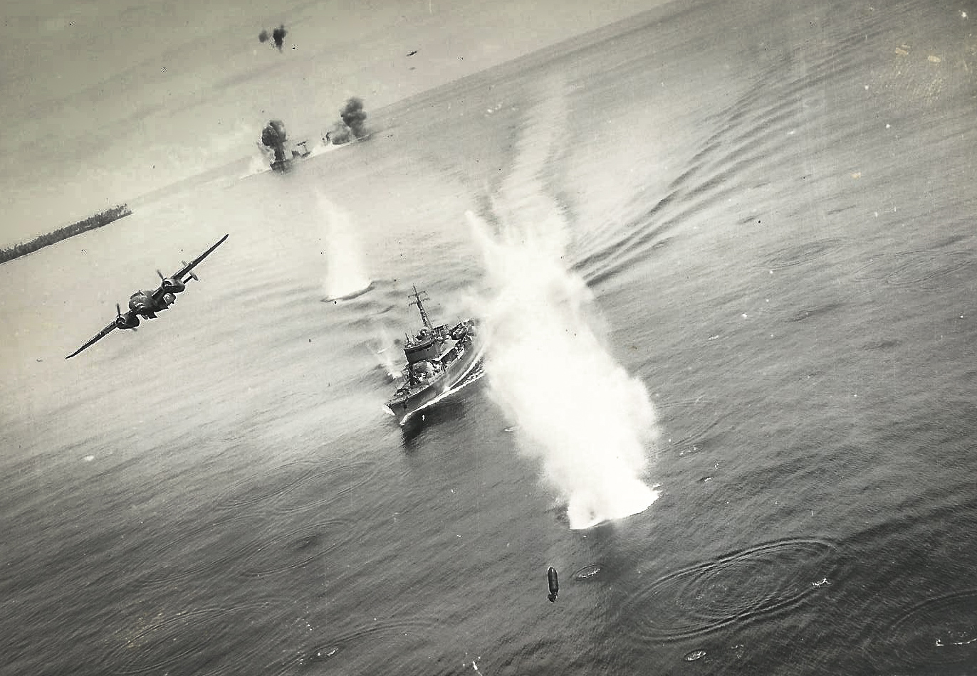 A spectacular image of Air Apaches in action against the Imperial Japanese fleet during the Pacific campaign in WWII. Note the skipping 500lb bomb in the near foreground and the second ship under attack by other B-25s to the rear. (photo via 345th BG Association)