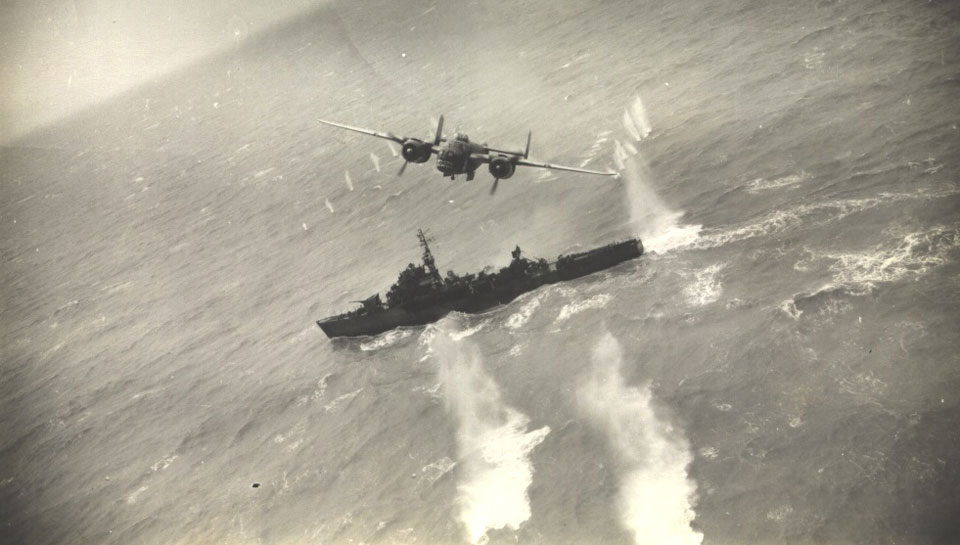 A B-25 Mitchell of the 345th BG 'Air Apaches' attacks a Japanese destroyer during WWII. (photo via EAA)