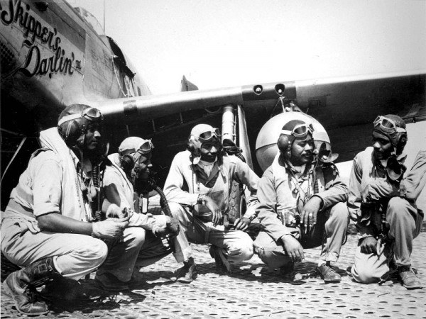 Pilots of the 332nd Fighter Group, "Tuskegee Airmen," the elite, all-African American 332nd Fighter Group at Ramitelli, Italy., from left to right, Lt. Dempsey W. Morgran, Lt. Carroll S. Woods, Lt. Robert H. Nelron, Jr., Capt. Andrew D. Turner, and Lt. Clarence P. Lester. (U.S. Air Force photo- Via Wikepedia)