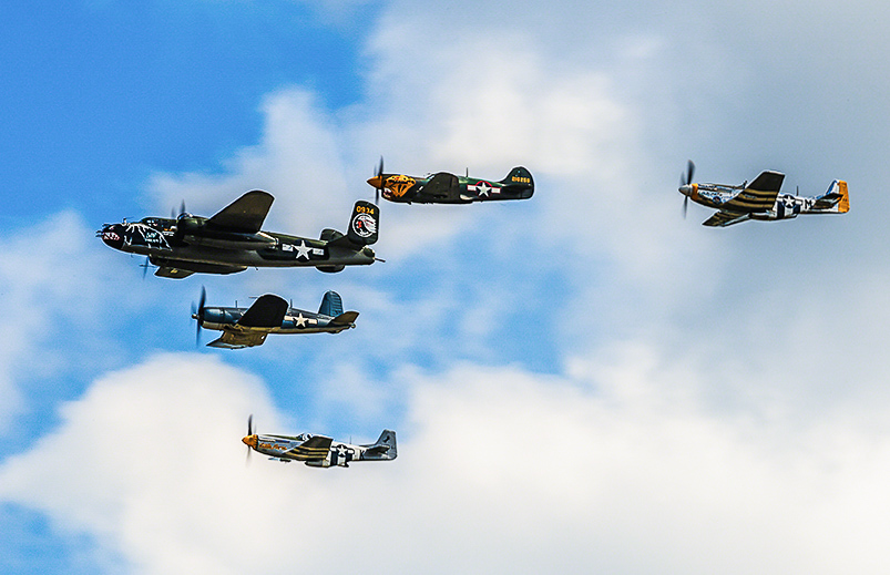 The Texas Flying Legends Museum Vic on it's initial flypast over AirVenture. (photo by Jake Peterson)