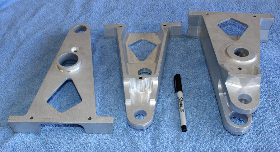 One of the project's machine shops completed the two XP-82 non-boosted aileron hinge points. The left-hand pair shows the two separated sub-components. (photo via Tom Reilly)