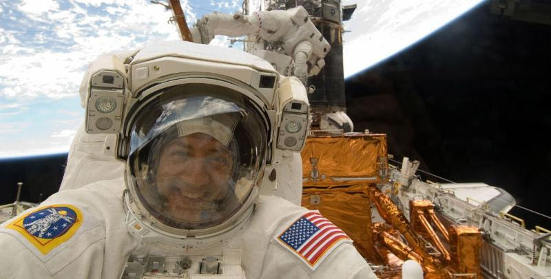 Astronaut Mike Massimino during spacewalk. NASA photo. 
