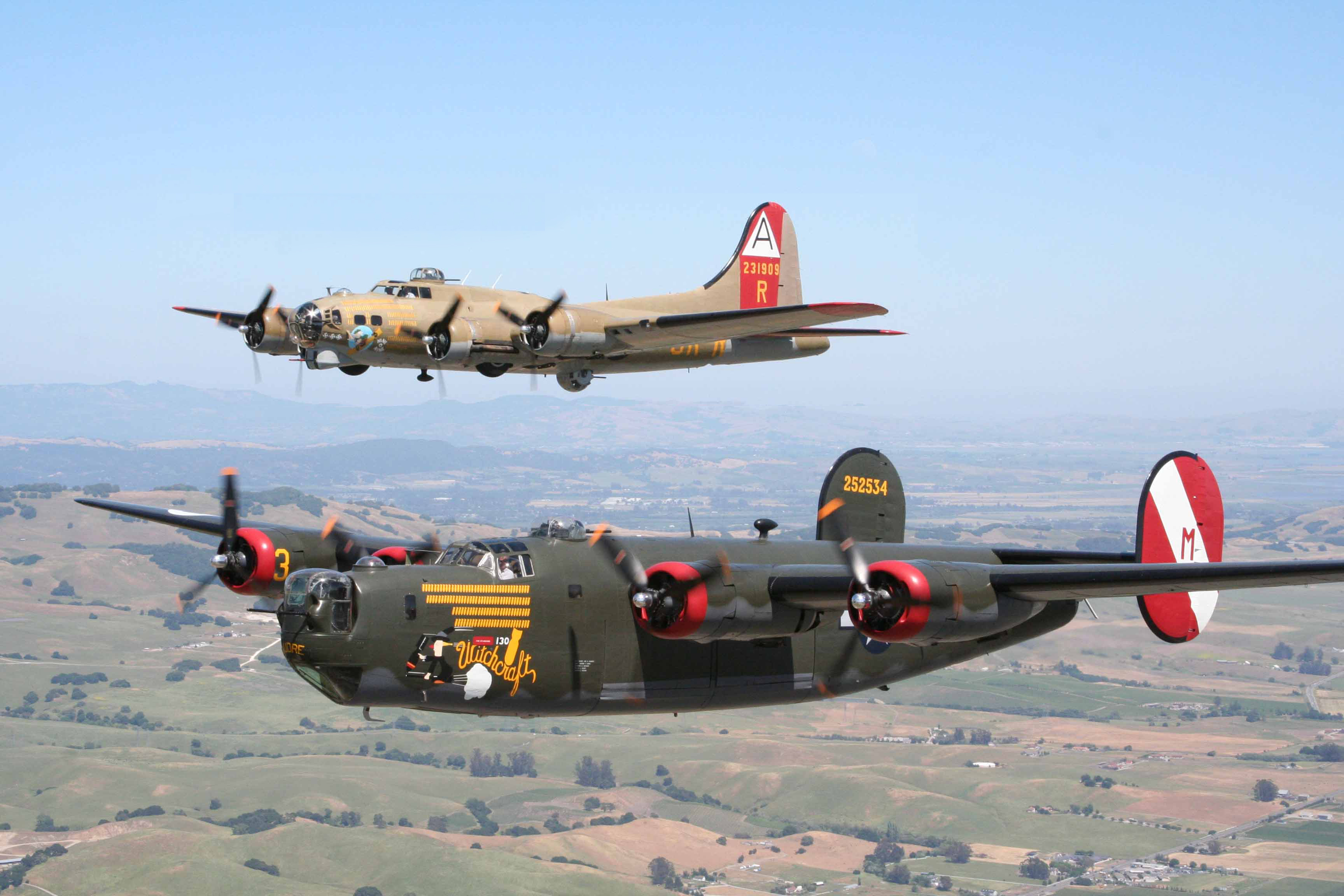 The Foundation’s 1944 vintage Consolidated B-24J Liberator is painted as "Witchcraft", an 8th AF bomber that flew a record 130 missions over Europe as part of the 467 th BG. The Boeing B-17G Flying Fortress flies as "Nine-O-Nine", an 8 th Air Force, 91 st BG heavy bomber. ( Image by Collings Foundation)
