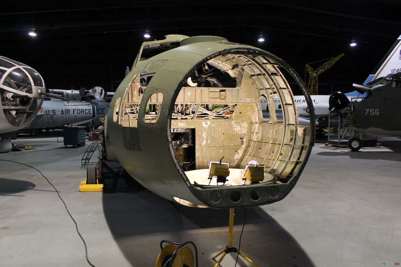 View inside the B-17’s nose compartment with the windows removed. The light stand is in the hole where the chin turret was located. ( Photo via Museum of Aviation Warner Robins)