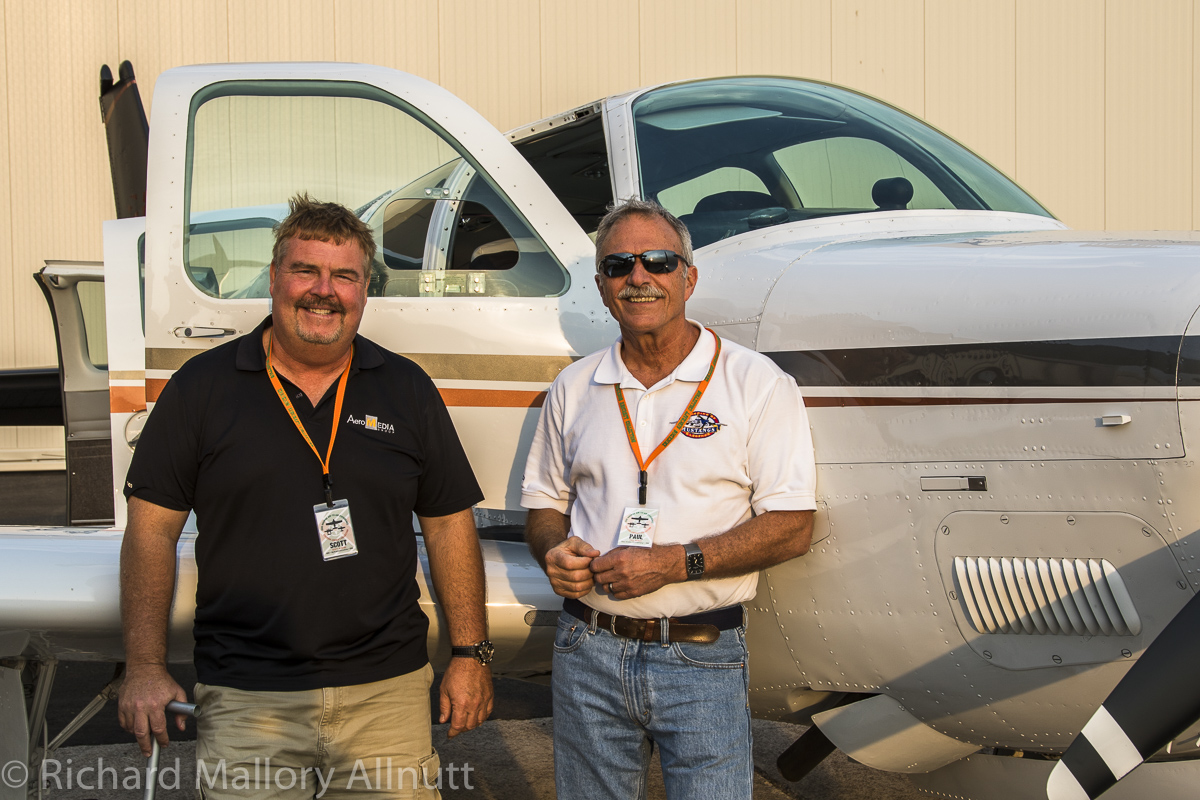 Scott Slocum (l) and Paul Bowen (r) standing in front of Slocum's gleaming Beach Bonanza which will be the photo-ship for many of the air-to-air sessions. (photo by Richard Mallory Allnutt)
