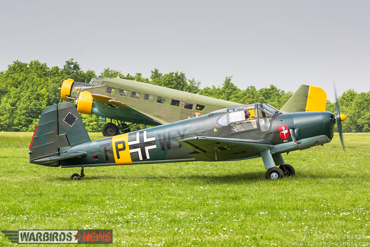 A Bücker Bü 181 Bestmann taxis in front of a Junkers Ju-52, one of two such transports flying at the show. (photo by Andreas Zeitler)
