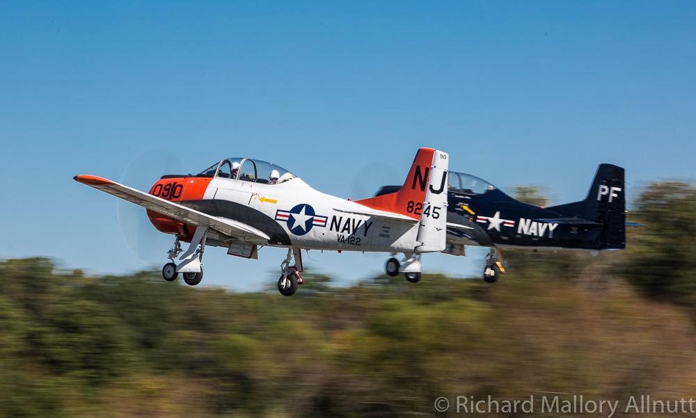 A pair of T-28s took off in close formation as part of the massed trainer flypast. (photo by Richard Mallory Allnutt)