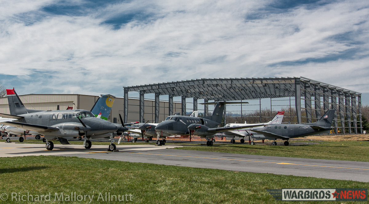 Columbine II's purpose-built hangar is rising at the airfield, seen here behind a small selection of Dynamic Aviation's significant fleet of contract aircraft. (photo by Richard Mallory Allnutt) 