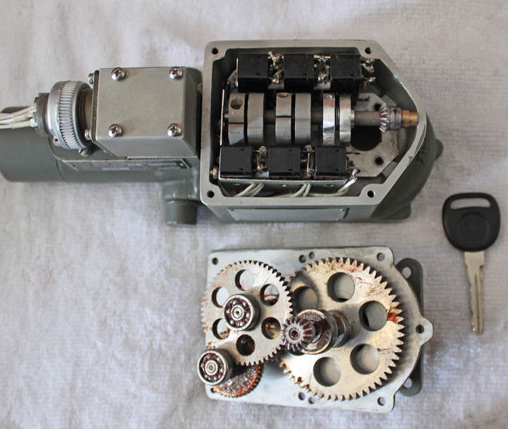 Another image of a Carburetor Air Temperature Control Motor with it's protective lid removed beside a reduction gear assembly. (Photo via Tom Reilly)(Photo via Tom Reilly)