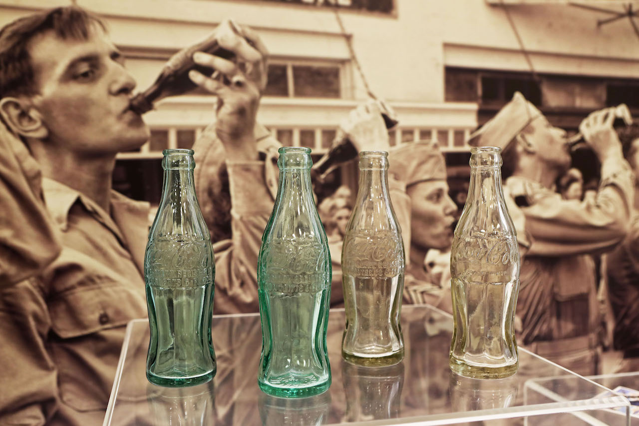Clear Coca-Cola Bottles -Manufactured in plants across the Midwest, clear Coke bottles were produced for shipment overseas. These examples were recovered on New Georgia Island, in the South Pacific. “Green” Coca-Cola Bottles -Manufactured on the West Coast of the United States, Green Bottles produced for the state-side market were shipped overseas until regional bottling plants could be set up using clear bottles. These examples were recovered on Guadalcanal, in the South Pacific.