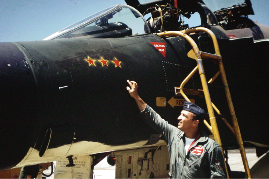 Capt. Milan Zimmer, Lt.Col Titus's WSO for his MiG kill on Route PAK 6, indicating the three stars for three MiGs shot down in 1967.