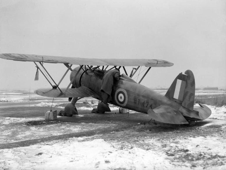 A captured Italian Fiat CR.42 Falco (RAF serial BT474) of the RAF Air Fighting Development Unit, parked in a dispersal at Duxford, Cambridgeshire (UK). The aircraft was salvaged following a forced landing at Orfordness, Suffolk, on 11 November 1940, and was kept by the AFDU through the war. It is preserved and displayed at the Royal Air Force Museum Hendon, as MM5701 '13-95'. ( Image credit Wikipedia)