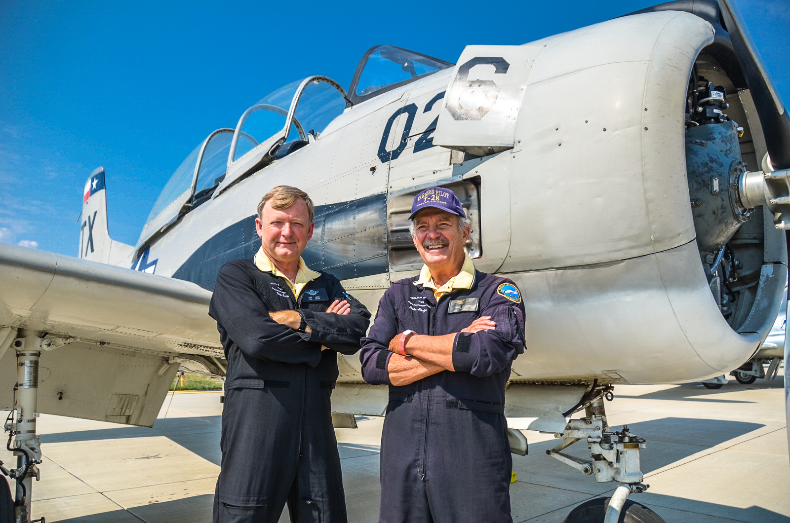 Chip Lamb and  John Sledge, the Trojan Phlyers, stand in front of one of their aircraft. (photo via Trojan Phlyers)