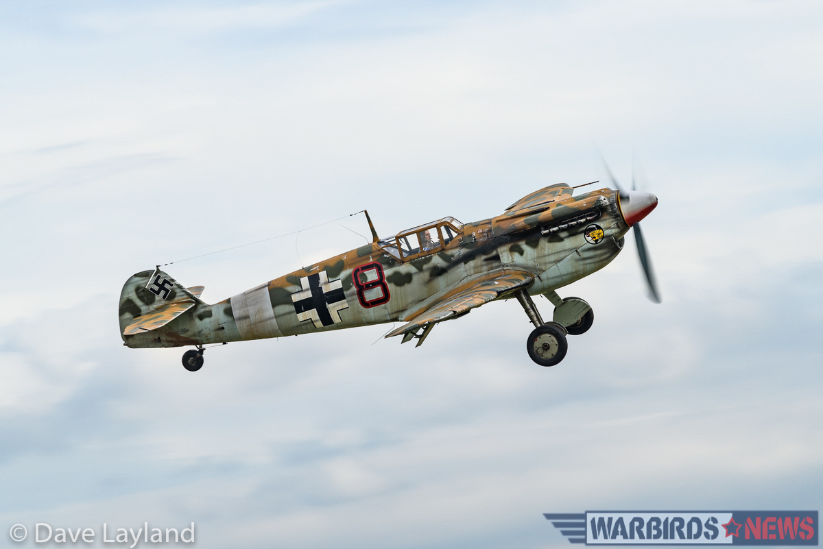 The Aircraft Restoration Company's Hispano Buchon dummied-up to look like a war-weary, desert- camouflaged Bf-109 of JG.27. (photo by Dave Layland)