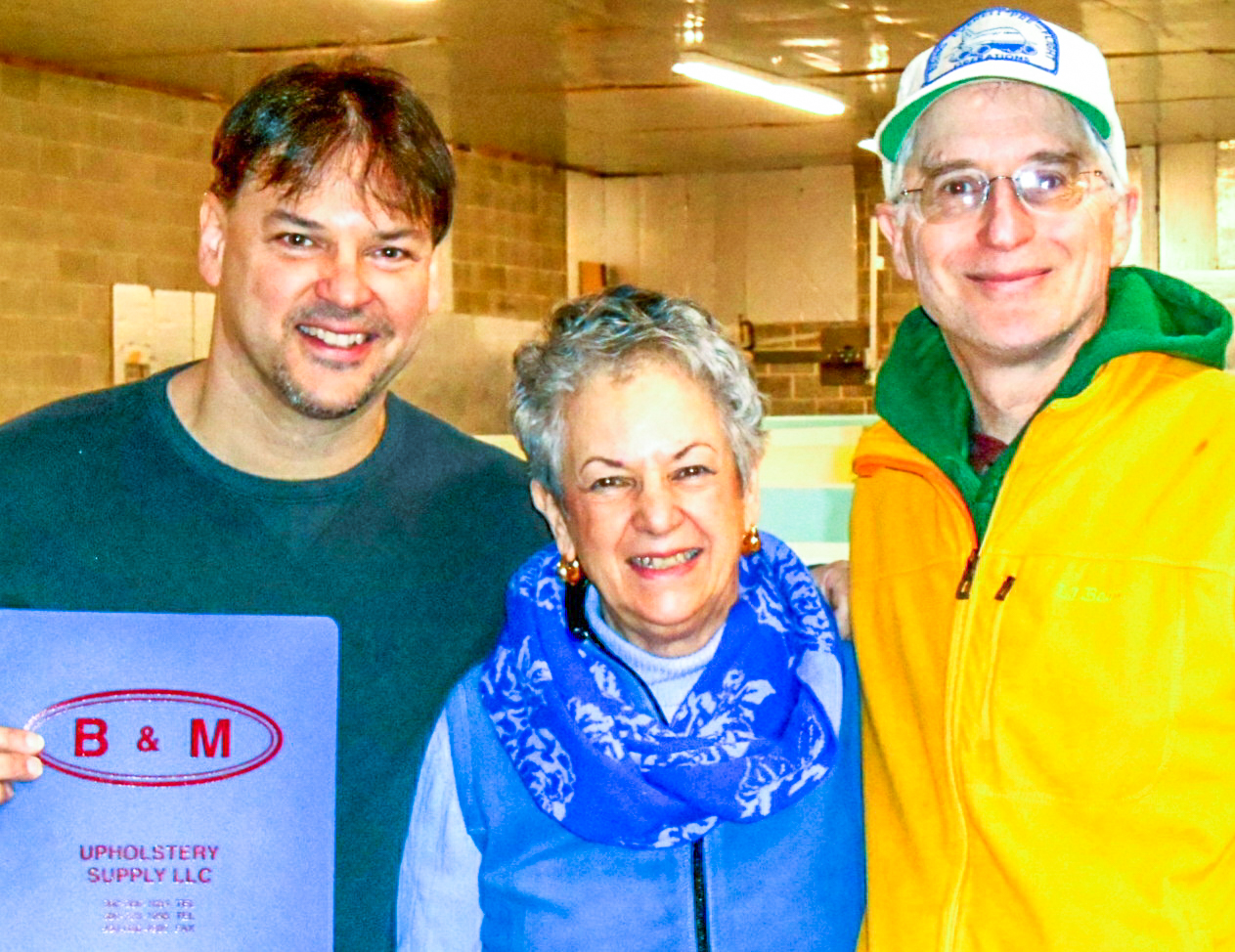 Bob Gagnon, Jr. and Mary Gagnon from B & M Upholstery Supply with Willie Althammer, DC-3 restoration volunteer. (photo via NEAM) 