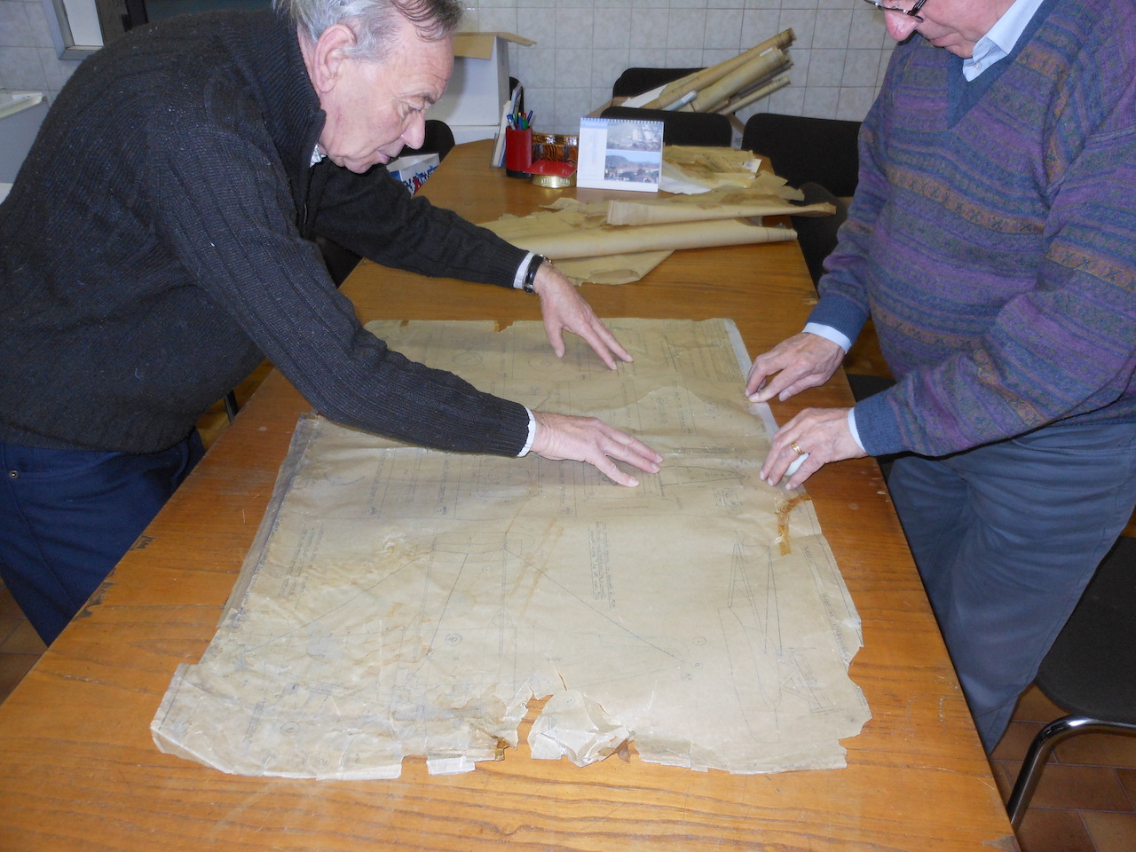 Ex employees of Siai-Marchetti preserving the original engineering drawings of the S.55 ( Photo by Savoia Marchetti Historical Group) 