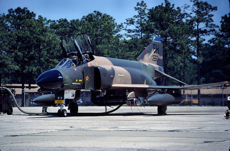 An F-4D Phantom II assigned to the 507th Tactical Fighter Wing, Air Force Reserves at Tinker, shown on the flight line during a training deployment during the 1980s. This jet wears a Vietnam-era MiG-kill marking in the form of a red and yellow star on the intake splitter-plate. (Courtesy photo by Don Jay)