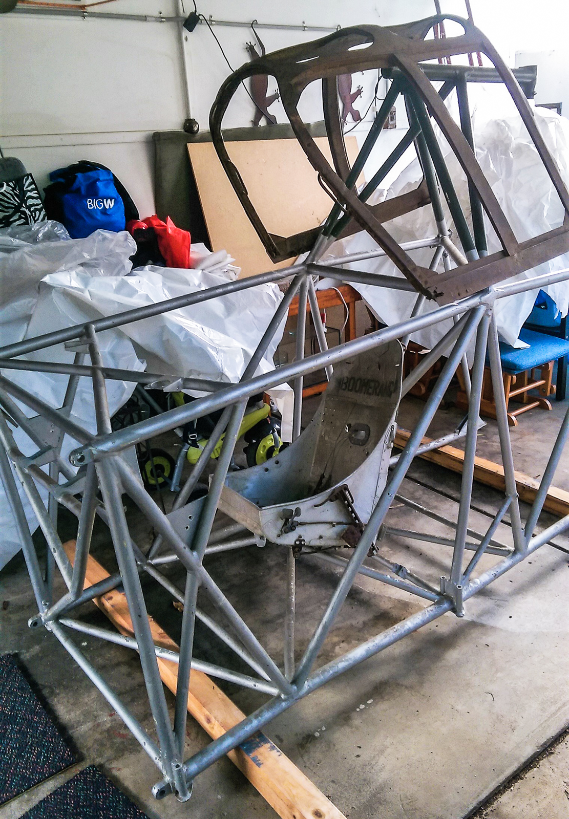 The statically restored fuselage frame for A46-3 sitting in Rick Anderson's garage. Note the unrestored cockpit canopy and pilot's seat in the image. (photo by Rick Anderson)