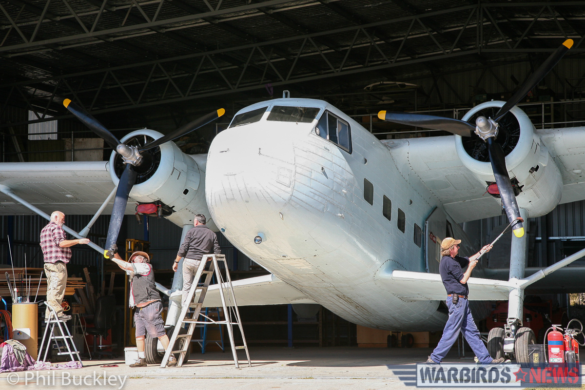 Pulling the props through in the shade, prior to wheeling her out for an engine test. (photo by Phil Buckley)