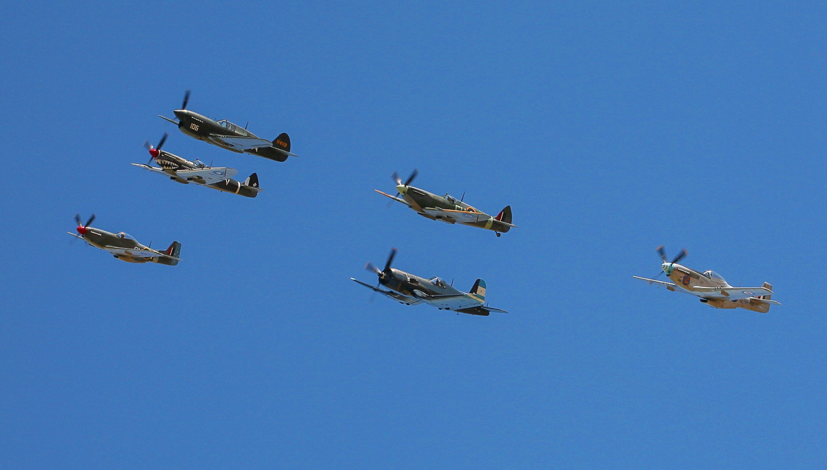 A gaggle of WWII-era fighters in formation was a highlight of Warbirds Downunder. (photo by Phil Buckley)