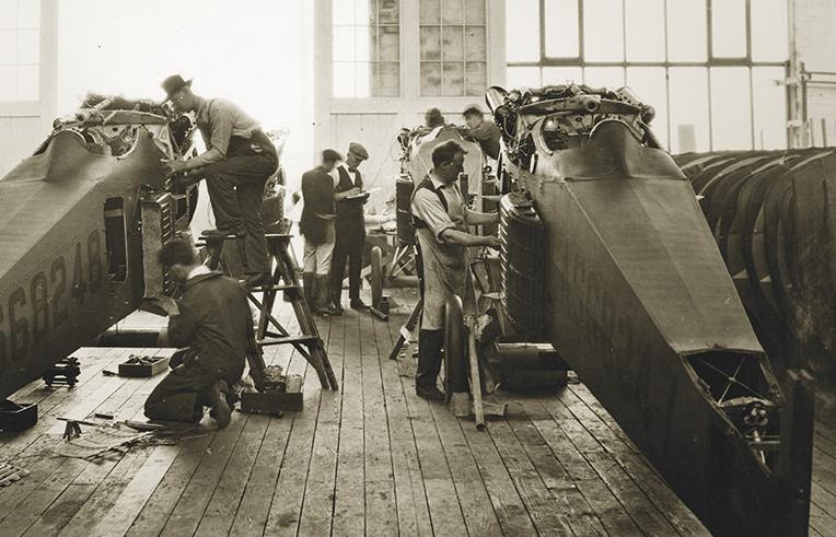 Working on airplanes in the original Boeing factory in the 1910s. 