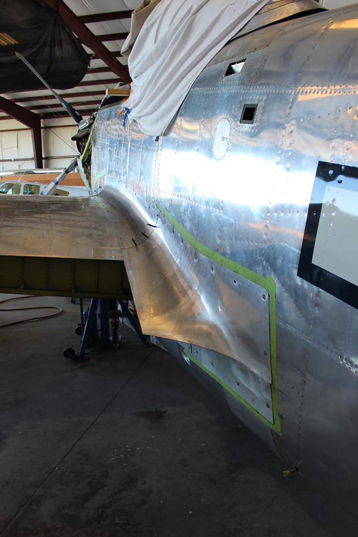 The lefthand outboard fuselage-to-center section fairing in place during trial fitting. (photo via Tom Reilly)
