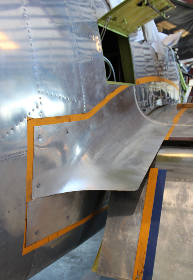 The lefthand inboard fuselage-to-center section fairing in place during trial fitting. (photo via Tom Reilly)