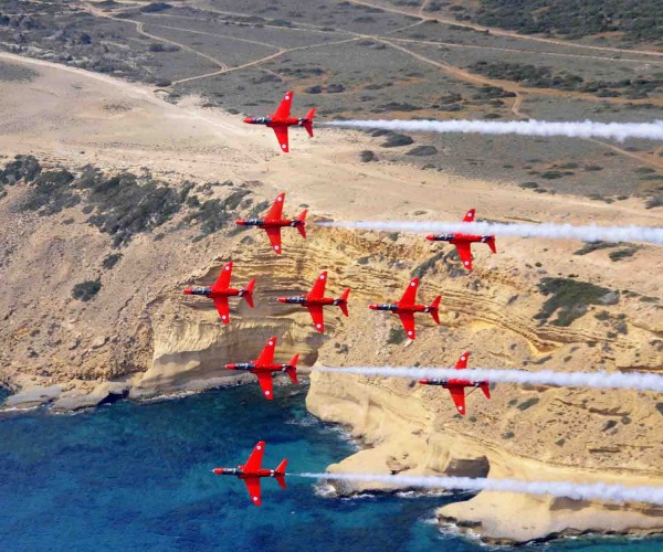 The Royal Air Force Aerobatic Team (RAFAT) The Red Arrows are currently on detachment at RAF Akrotiri in Cyprus. During the detachment The Red Arrows are practicing their display routine three times a day in training for the Public Display Authority (PDA) on 17th May 2013, which will allow them to display to the public during the summer season. During this detachment Red 10 Sqn Ldr Mike Ling has taken the RAFAT photographers up in his jet to conduct a "Photochase", photographing the jets display from the air. The purpose of this Photochase was to take an image of the nine jets in their "Lancaster" formation, to mark the 70th anniversary of the Dambusters Raid. Image entered the photcompetition in Category D Equipment under the title Lancaster. Image shows: The nine Red Arrows jets in Lancaster formation flying above the cliff of RAF Akrotiri. Image by SAC Craig Marshall (RAF) 15 Apr 2013 Crown Copyright
