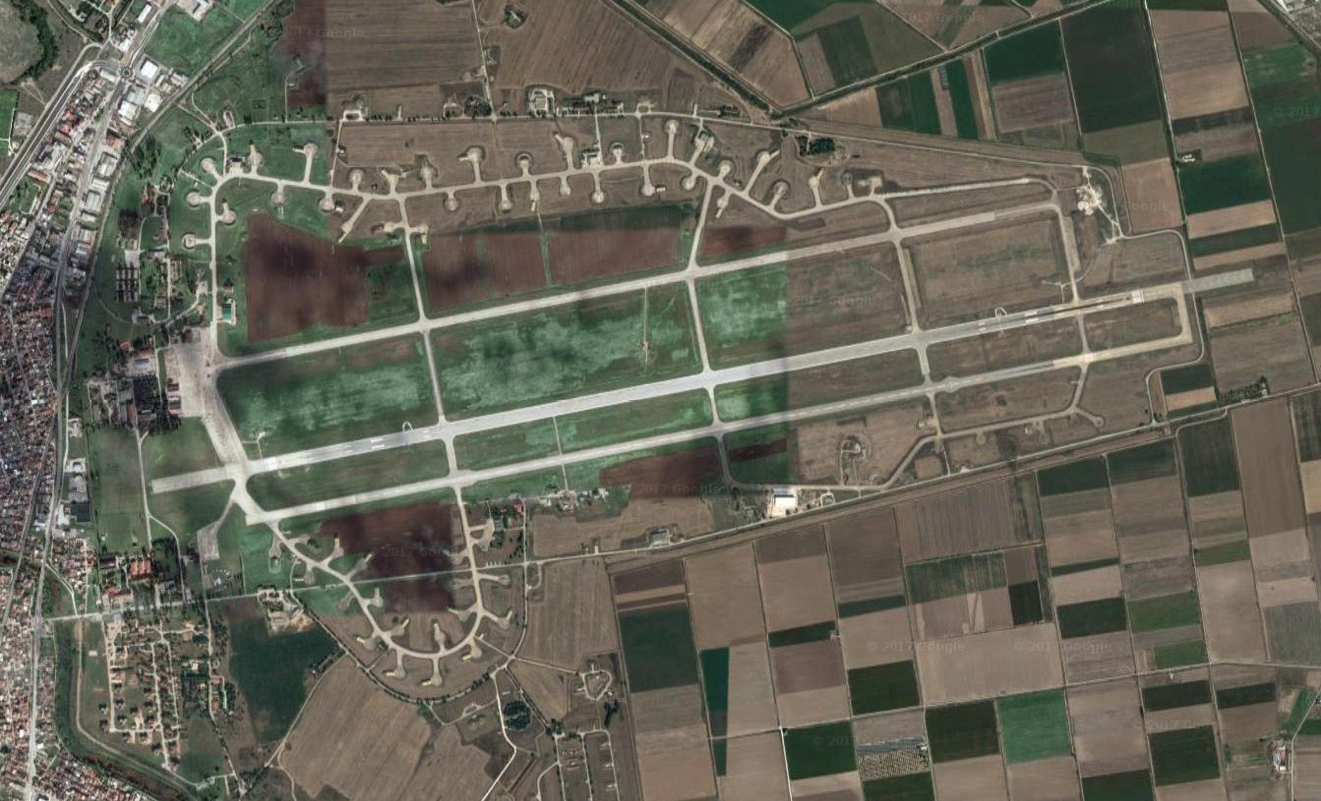 An aerial view of Larissa Air Force Base in northern Greece. 348 TRS occupied the northern edge, whereas 337 Squadron, an F-16 unit, still occupies the southern side. (photo via Googlemaps)