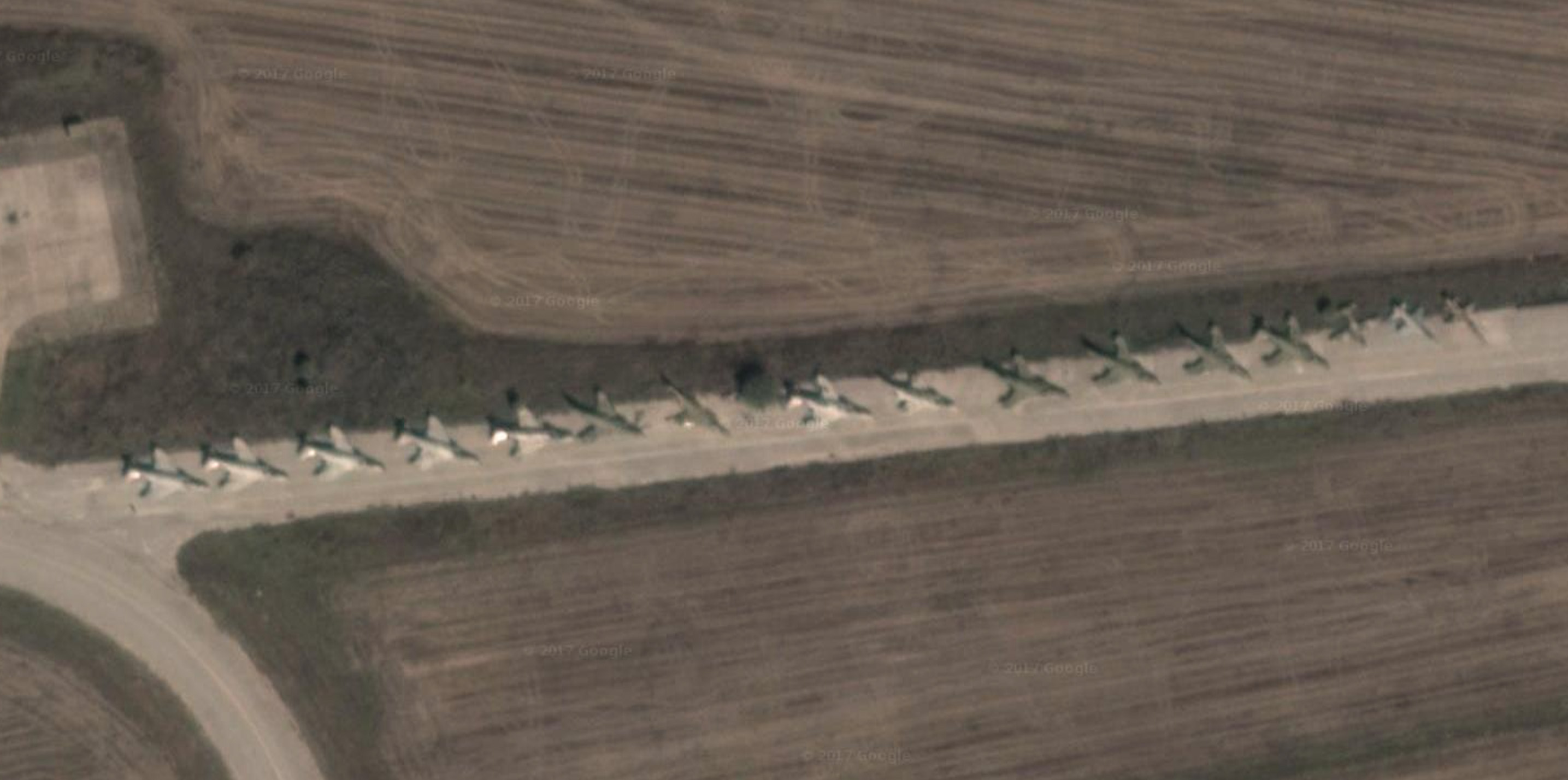 Some of the retired RF-4Es serving as decoys and parts sources at Larissa. (Photo via Googlemaps)