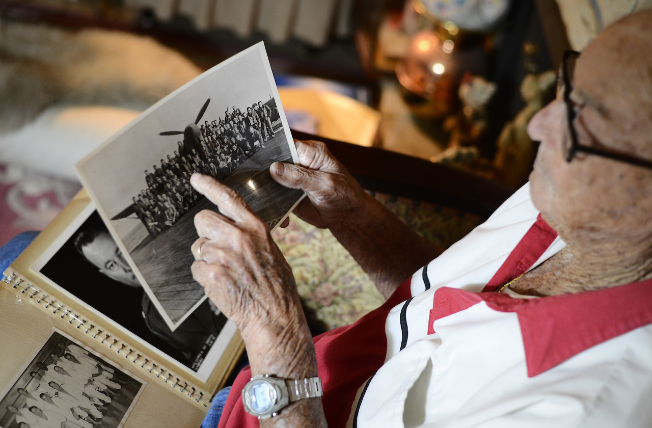 Retired Lt. Col. Clifton Ward, World War II and Vietnam combat pilot, explains details about a deployment photo during an interview at his home in Tampa, Fla., Oct. 28, 2015. Ward was stationed at MacDill Air Force Base from 1956 to 1959. After retirement in 1971 Ward and his family moved back to the Bay area and has lived there ever since. (U.S. Air Force photo by Tech. Sgt. Brandon Shapiro/Released)