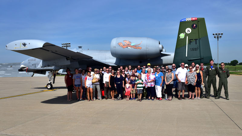 Members of John Dean Armstrong’s family and pilots from the 23rd Fighter Group pose for a photo, June 17, 2017, at McConnell Air Force Base, Kan. Eighty members of Armstrong’s family came from across the country to welcome Armstrong home after being missing for 75 years. The 23rd Fighter Group performed a missing man flyover for Armstrong's funeral. (U.S. Air Force photo/Staff Sgt. Trevor Rhynes)